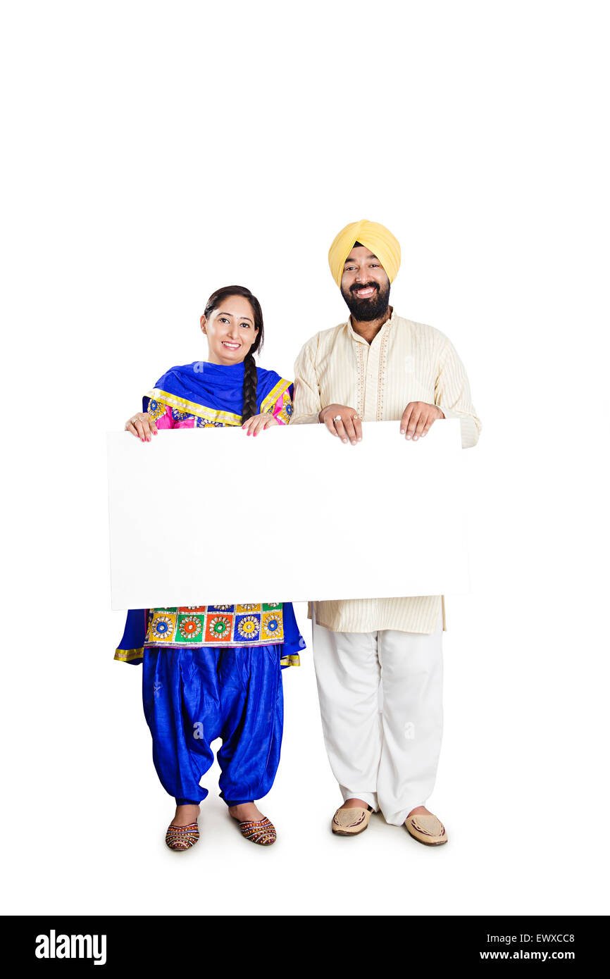 2 indian Punjabi Married Couple showing Message Board Stock Photo - Alamy