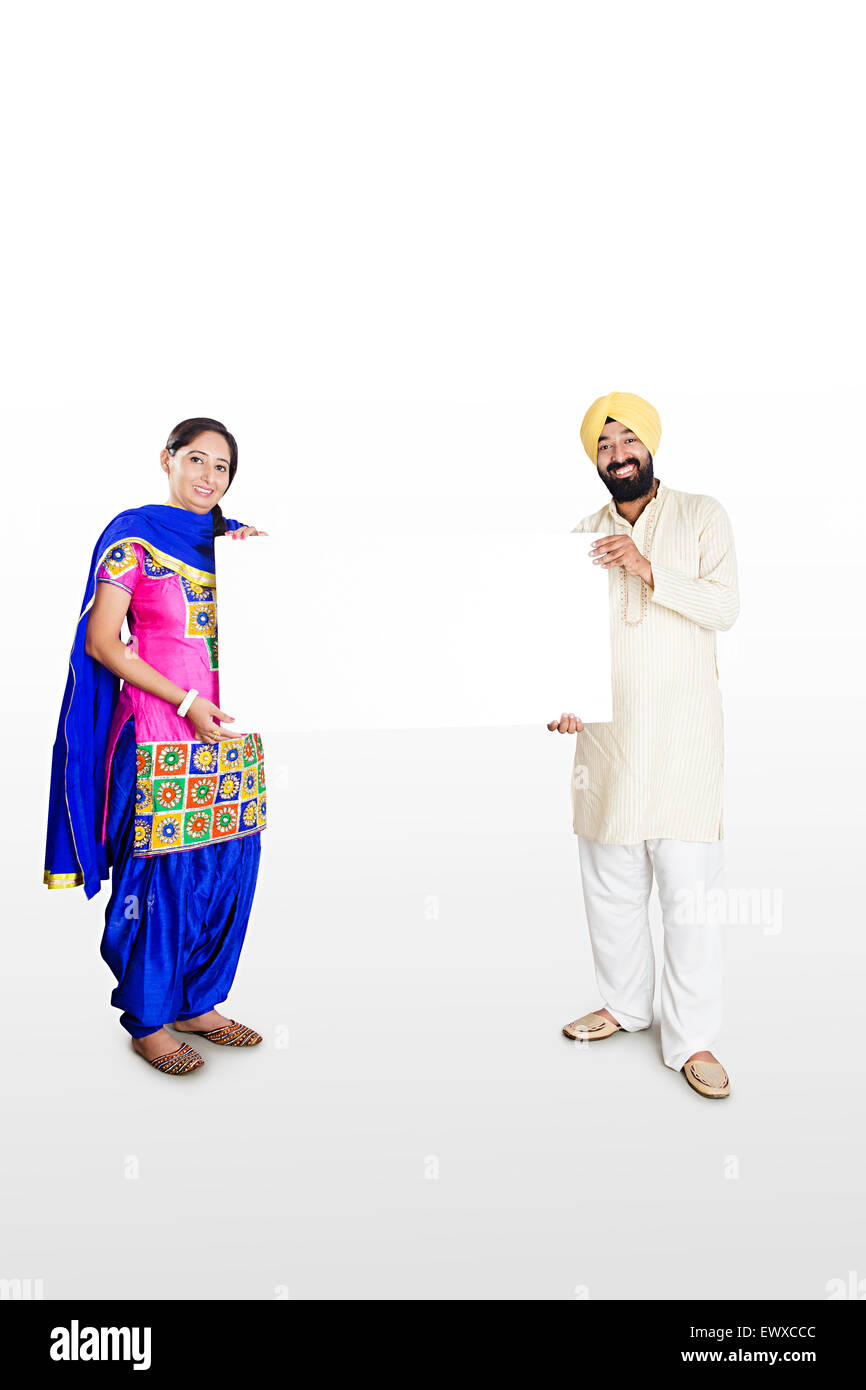 2 indian Punjabi Married Couple showing Message Board Stock Photo - Alamy