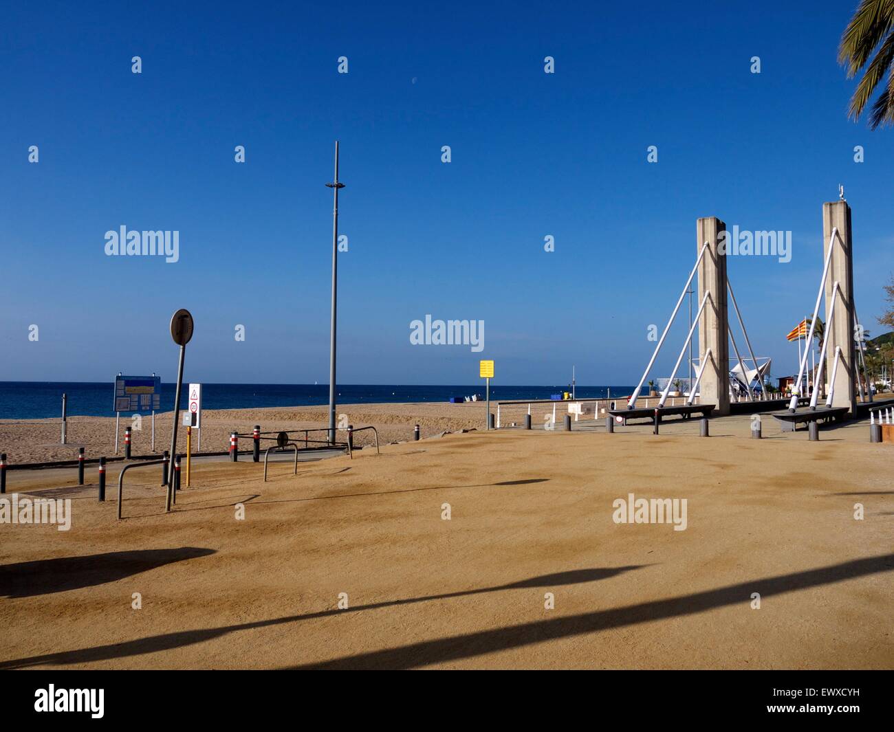 Beach and footbridge in Calella, Spain Stock Photo