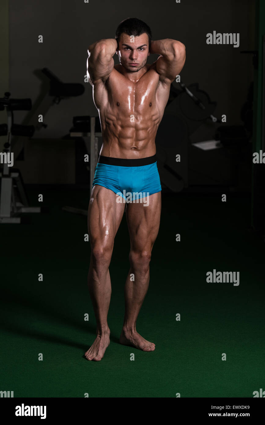 Teenage boy flexing muscles hires stock photography and images Alamy