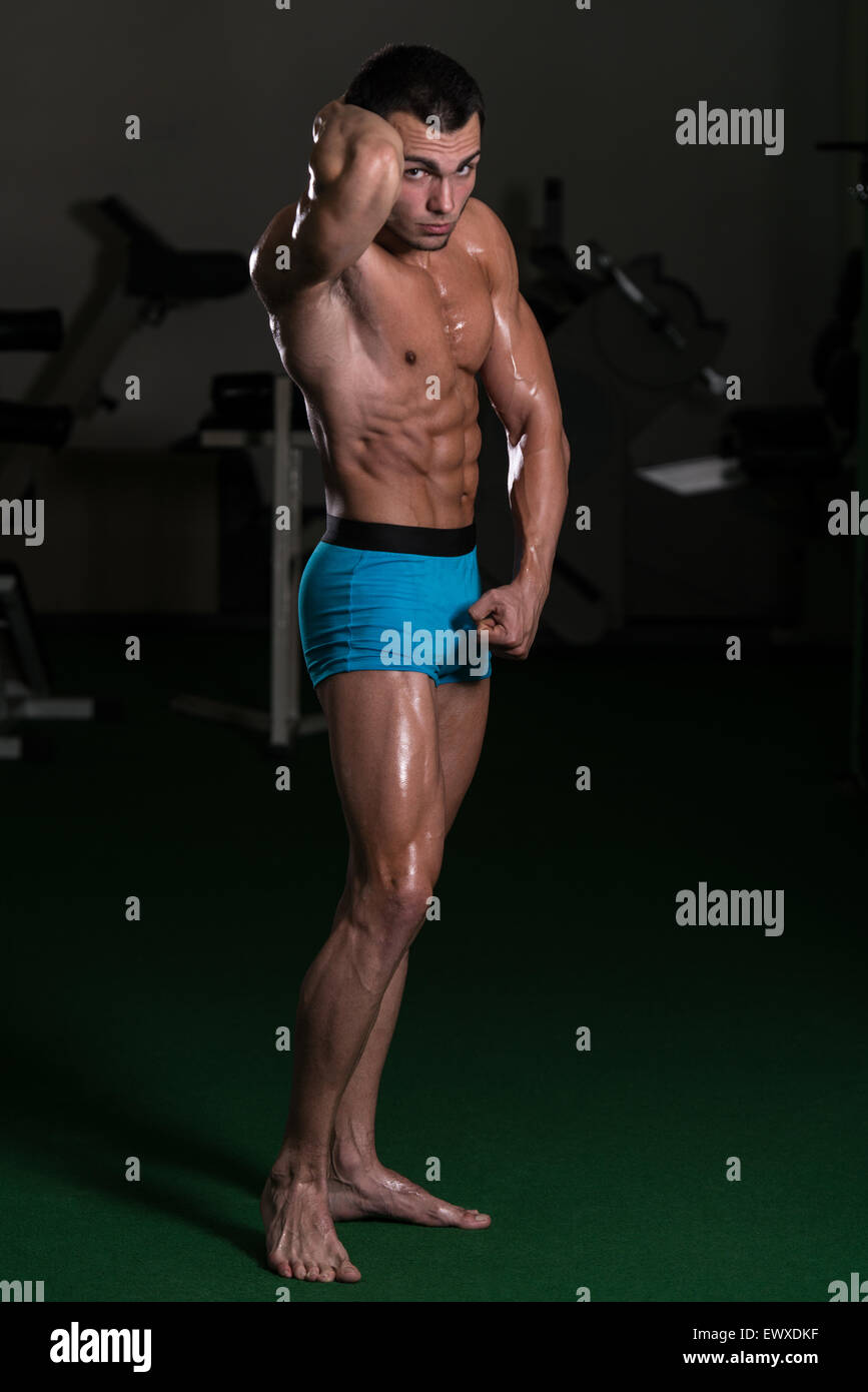 Body Builder Performing Front Abdominal Thigh Poses Stock Photo - Alamy