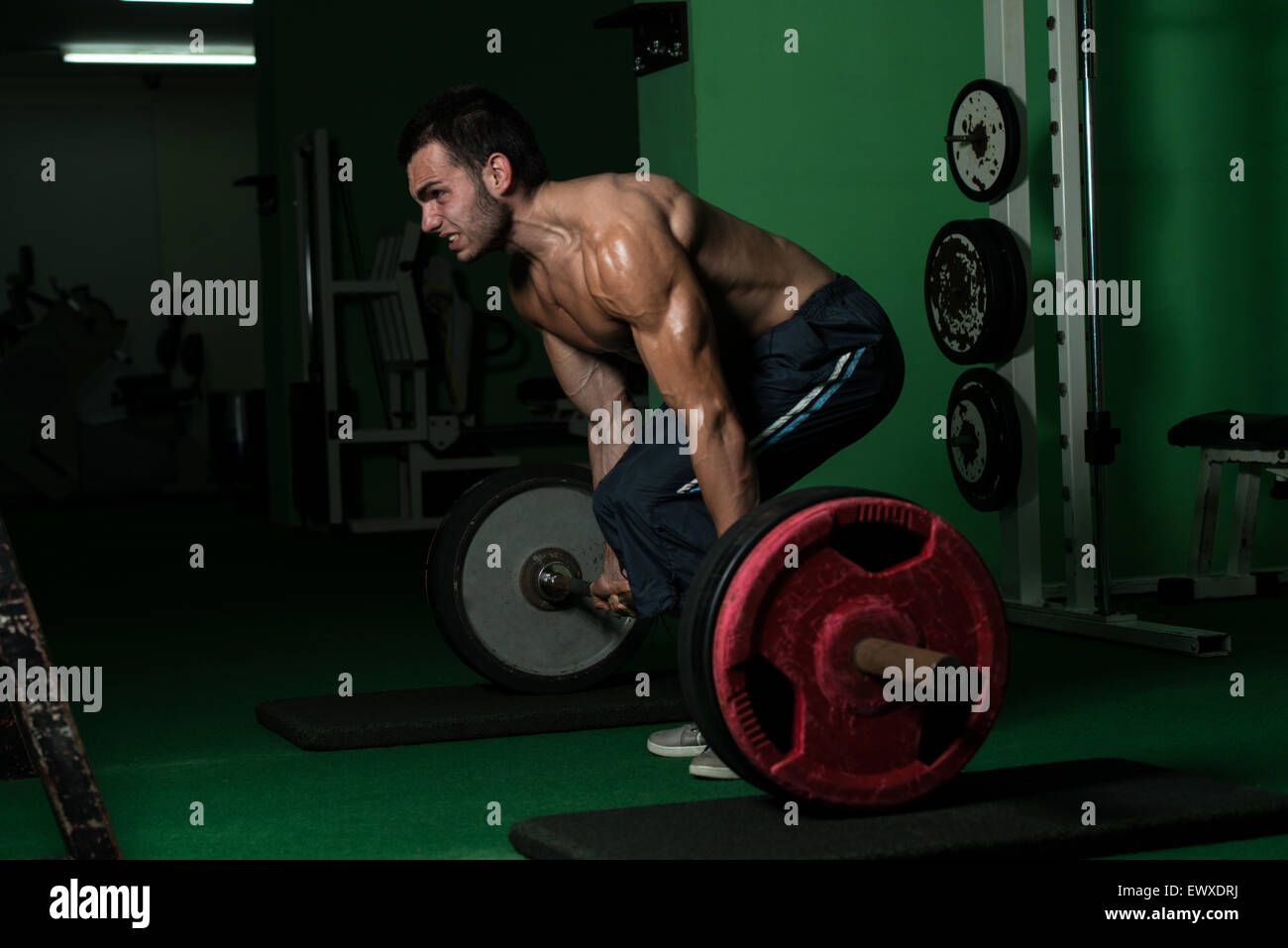 Muscular Man Lifting Dead Lift In The Gym Stock Photo