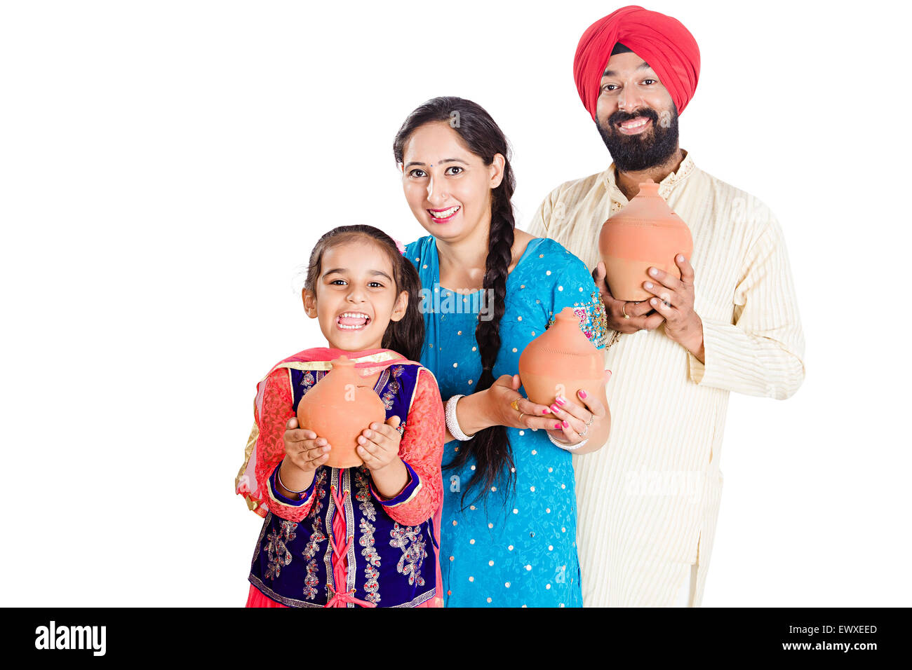 indian Punjabi Parents and daughter Saving money Piggy Bank Stock Photo ...