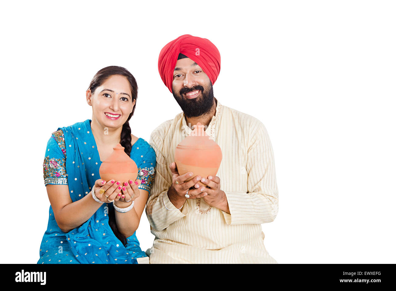 2 indian Punjabi Married Couple Saving money Piggy Bank Stock Photo - Alamy
