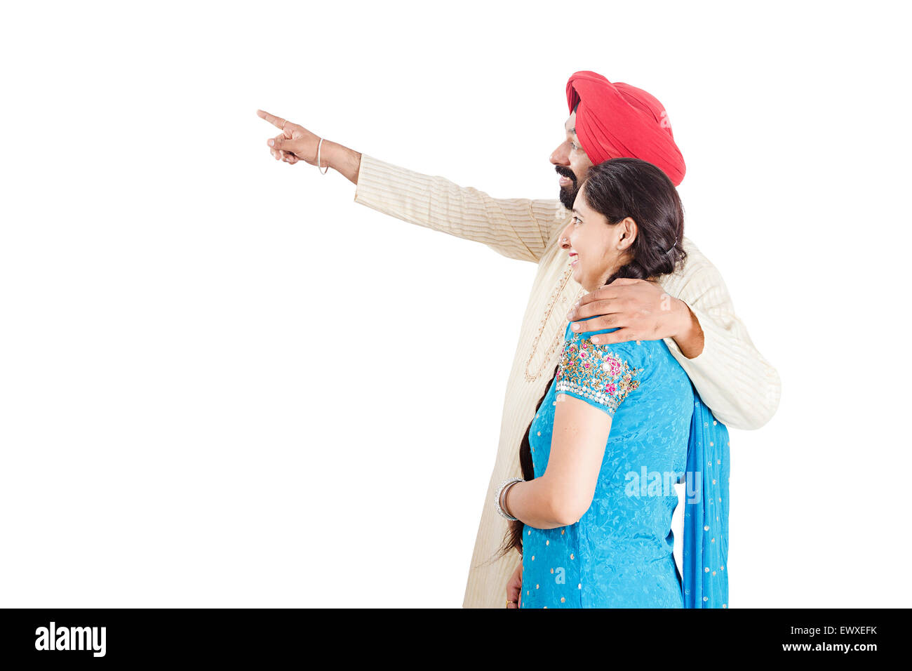 2 indian Punjabi Married Couple finger Pointing Stock Photo - Alamy