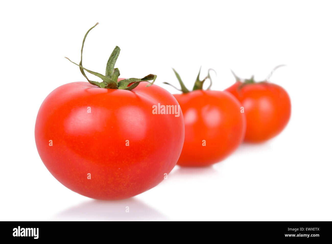 three ripe isolated tomatoes Stock Photo - Alamy