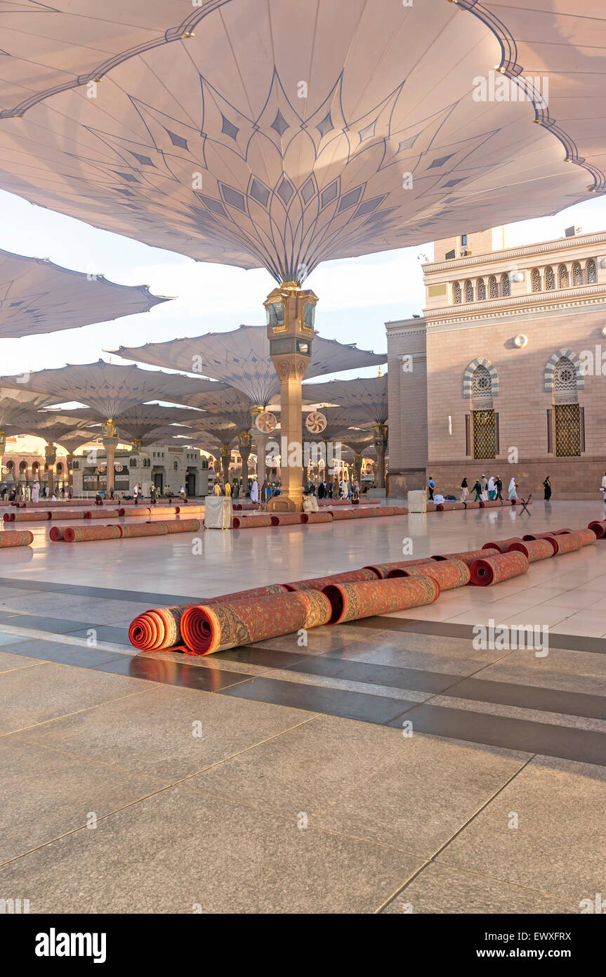 MEDINA MARCH 06 Pilgrims walk underneath giant umbrellas at Nabawi Mosque compound on March