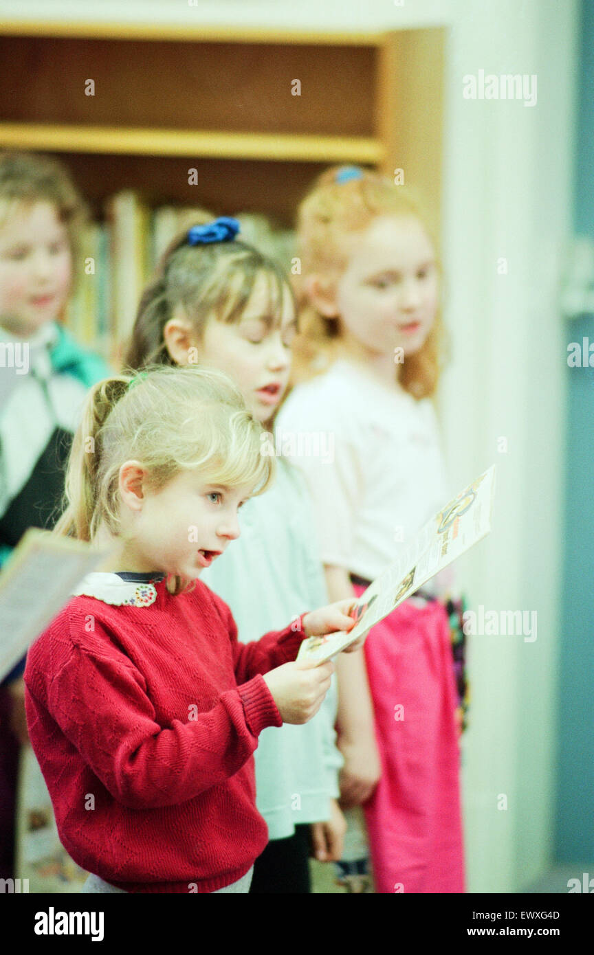Children from Abingdon Junior School caused quite a stir when they sang Christmas Carols at Middlesbrough Central Library, 9th December 1992. Stock Photo