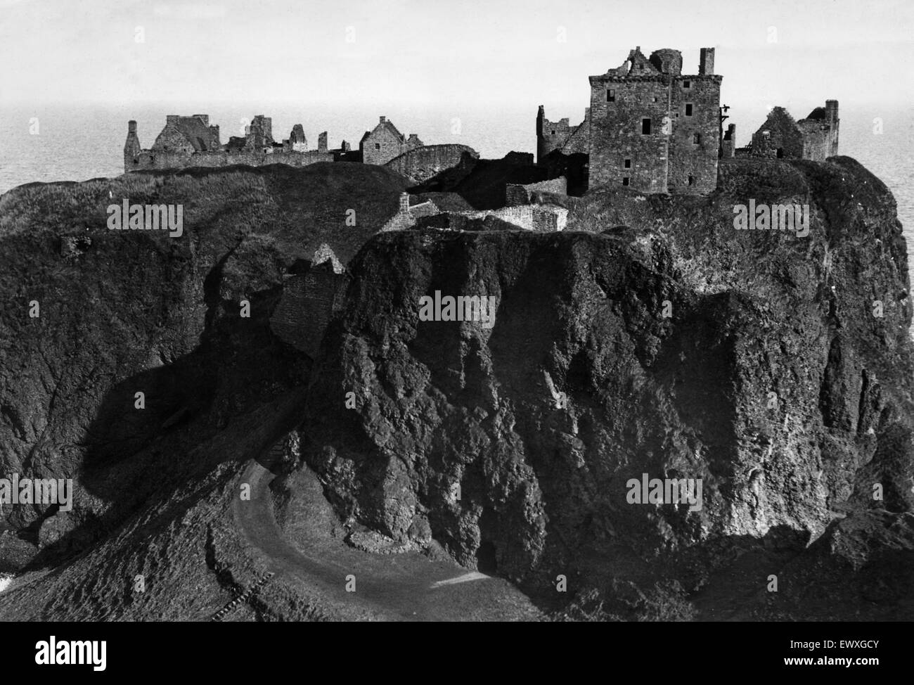 General view of the ruined medieval fortress of Dunnottar Castle near Stonehaven, Aberdeenshire. Circa 1935. Stock Photo