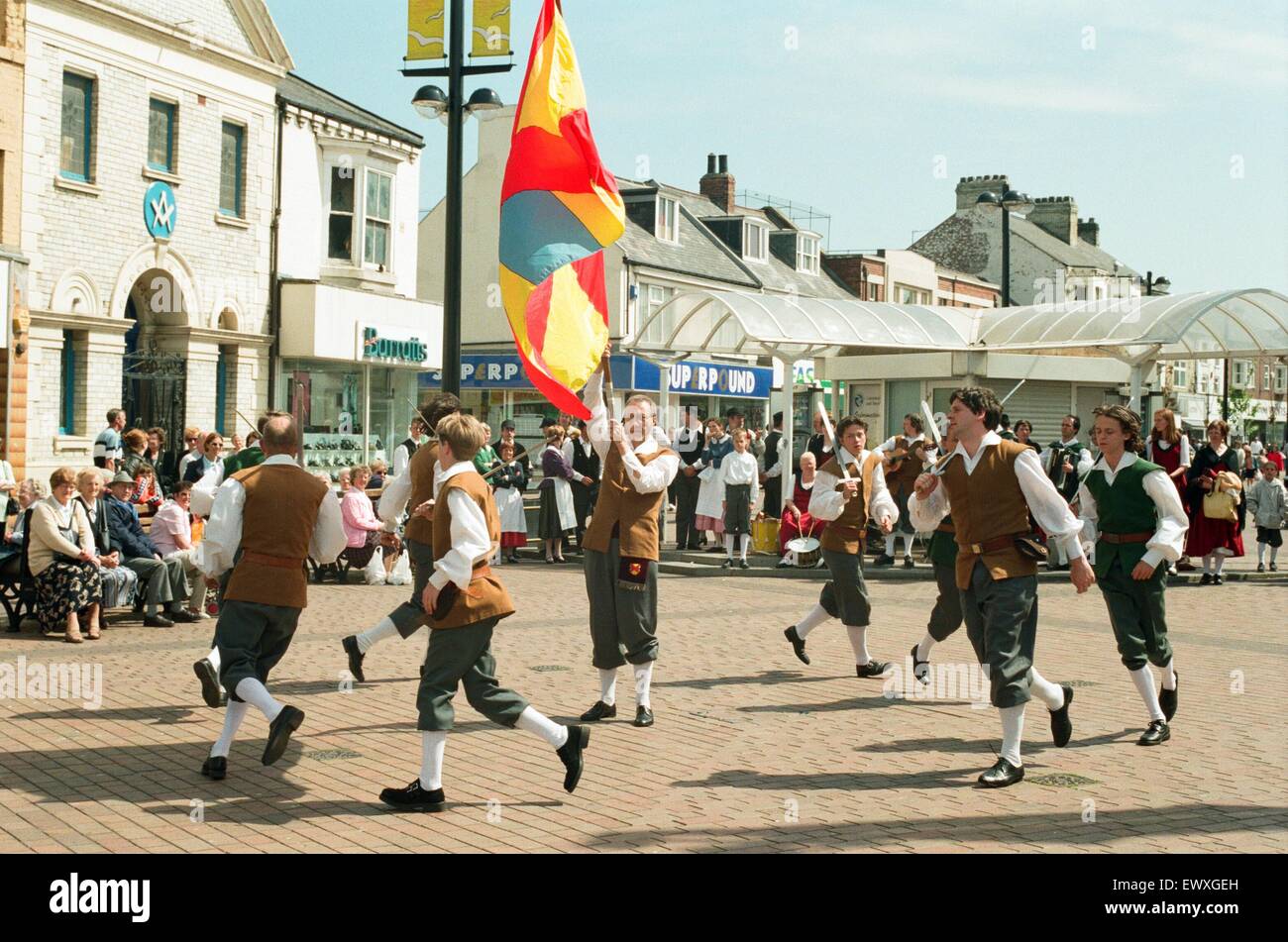 Sword and folklore dancers are converging on the Whitby area for a festival. Shoppers in Redcar High Street were entertained by a group from Belgium, De Woume. 22nd May 1998. Stock Photo