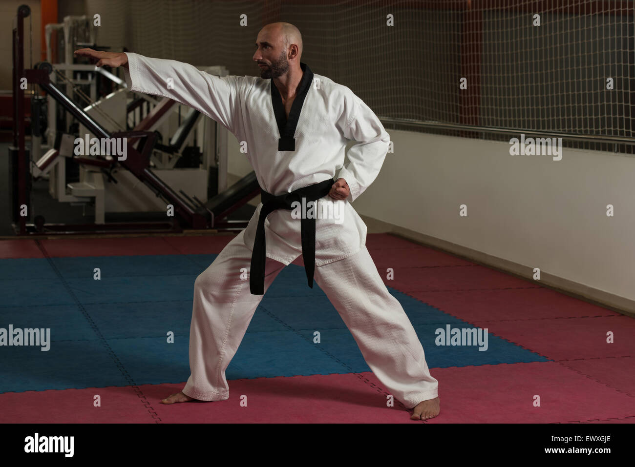 A Man, In A Black Kimono Is Practicing Martial Arts Technique With A Long  Bamboo Fighting Stick. Stock Photo, Picture and Royalty Free Image. Image  91980191.