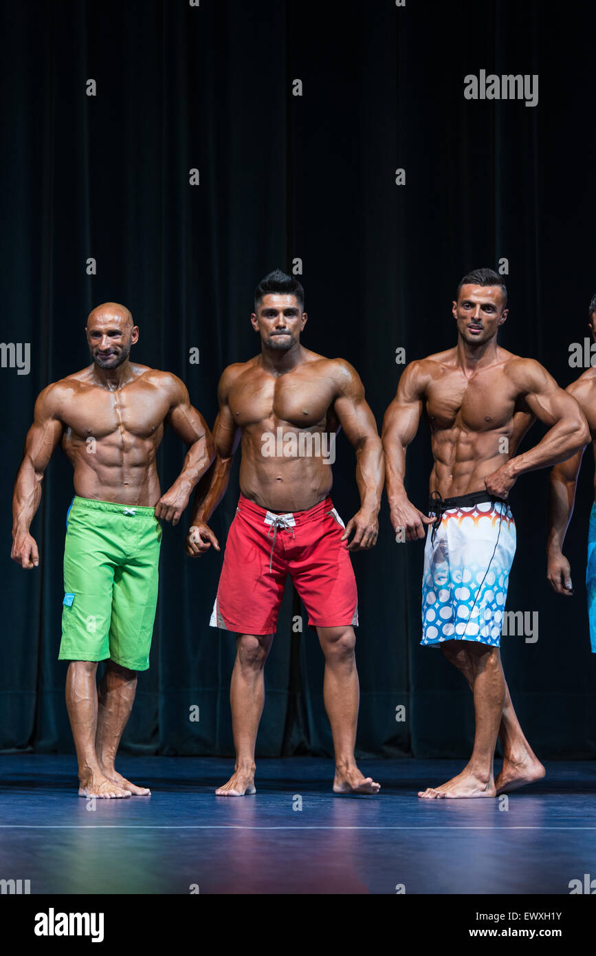 Mens Physique Posing During A Bodybuilding Competition Stock Photo Alamy