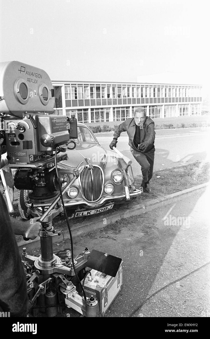 Richard Burton during location filming of "The Villain" . The cast and crew  where at the Clark Eaton Glass factory on the Southern industrial estate,  Bracknell to film a wages snatch scene.Burton