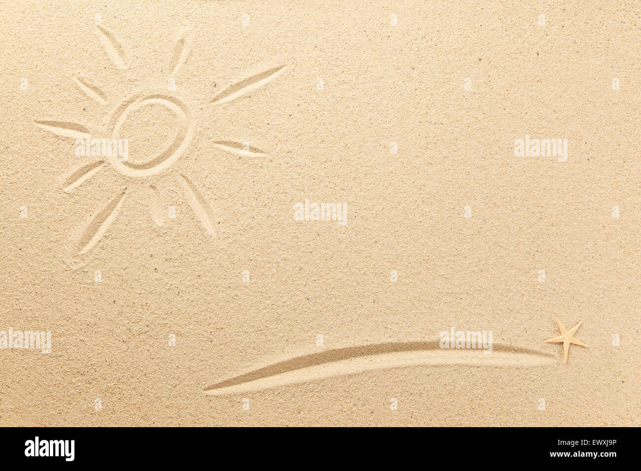 Drawn sun and underline in the sand Stock Photo