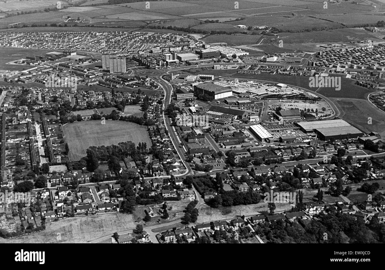 The huddled rooftops, the sprawling streets, green trees and multi-storey flats, long roads and wide open parks. They all add up to a panorama of Thornaby with the old village green and parish church in the foreground and the tree-bordered Village Park ac Stock Photo