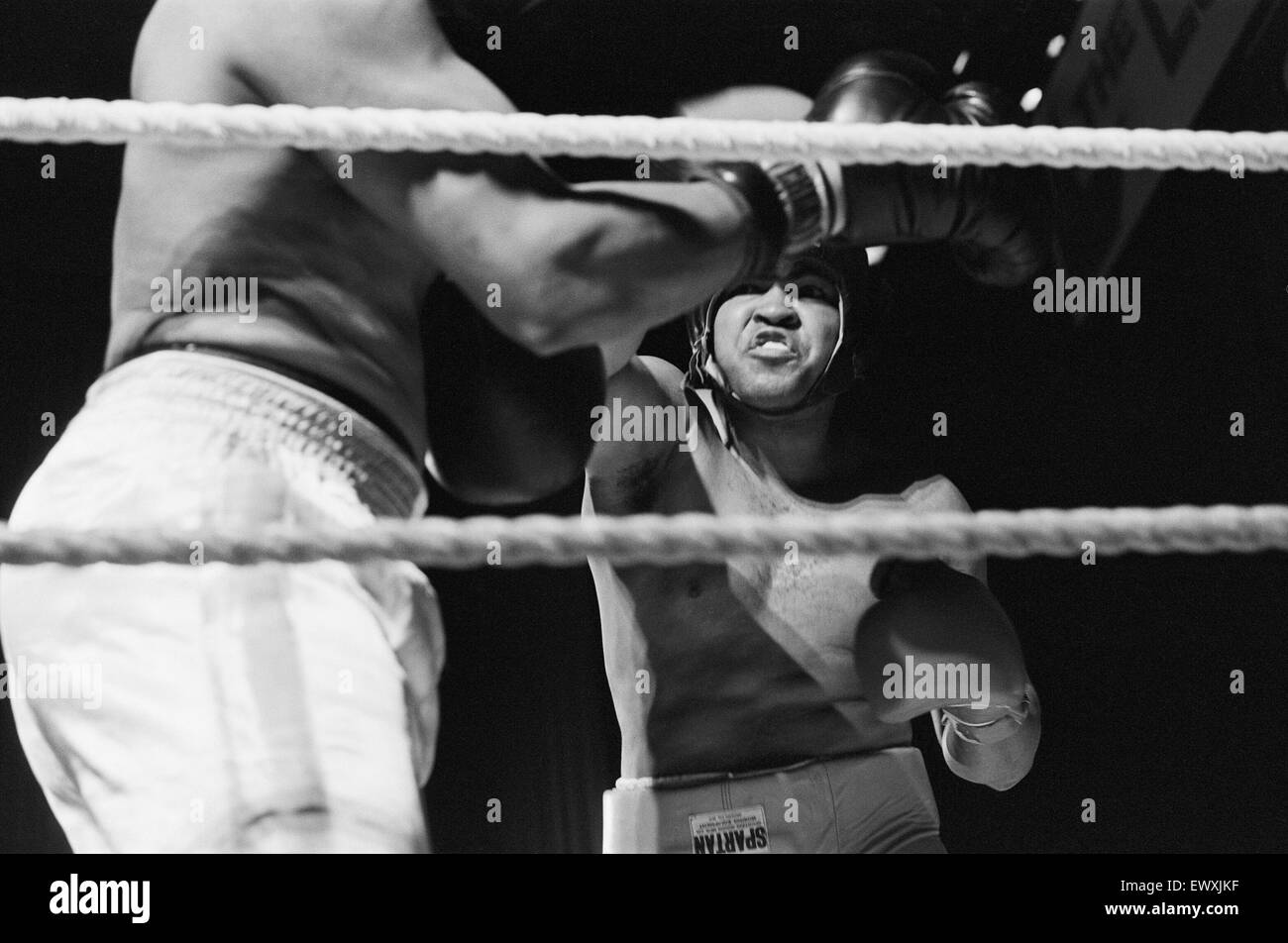Muhammad Ali having fun with a spectator at boxing exhibition match in