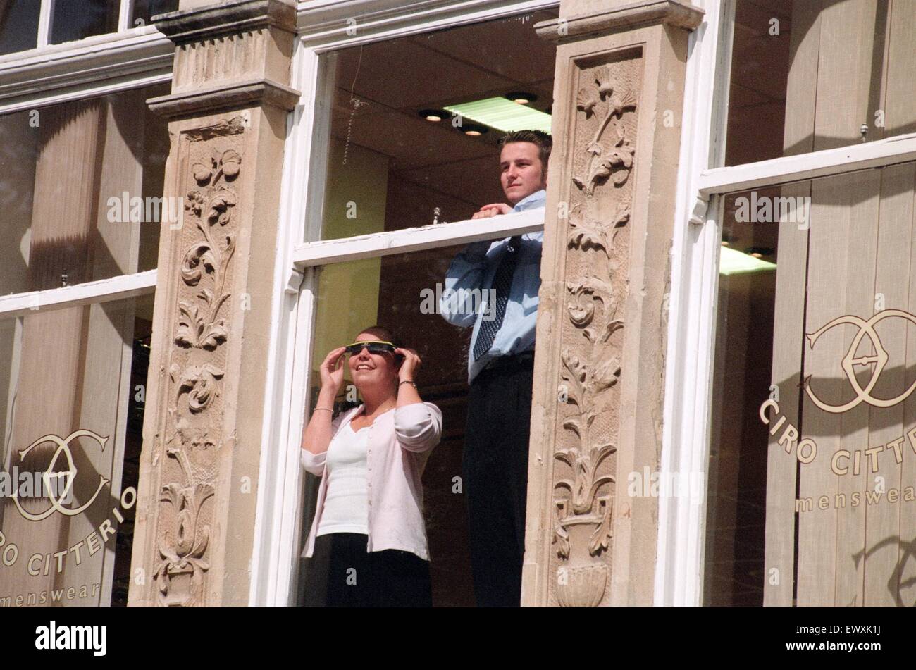 People watching a total solar eclipse, Queen Street, Cardiff. 11th August 1999. Stock Photo