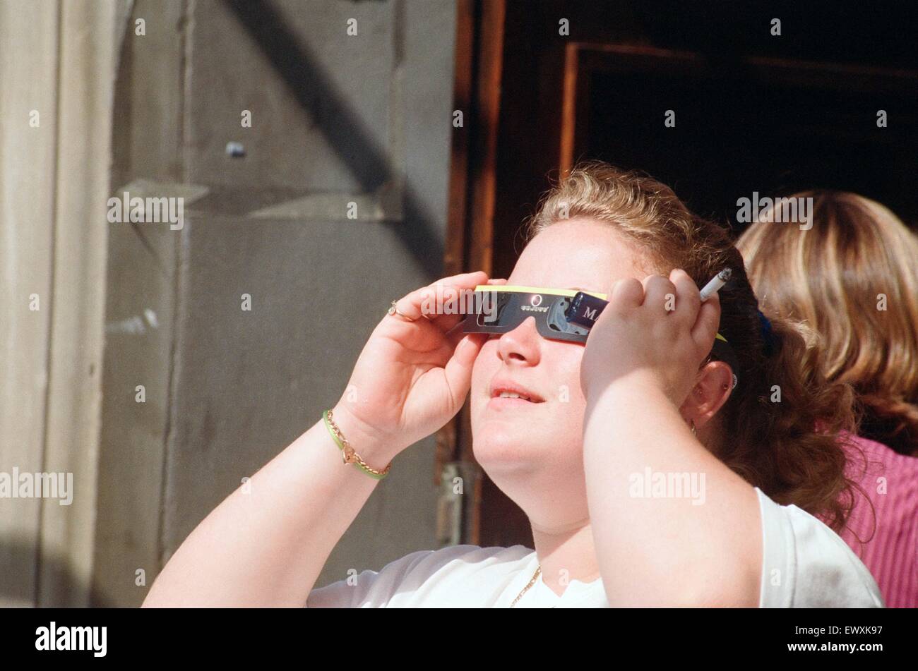 People watching a total solar eclipse, Queen Street, Cardiff. 11th August 1999. Stock Photo