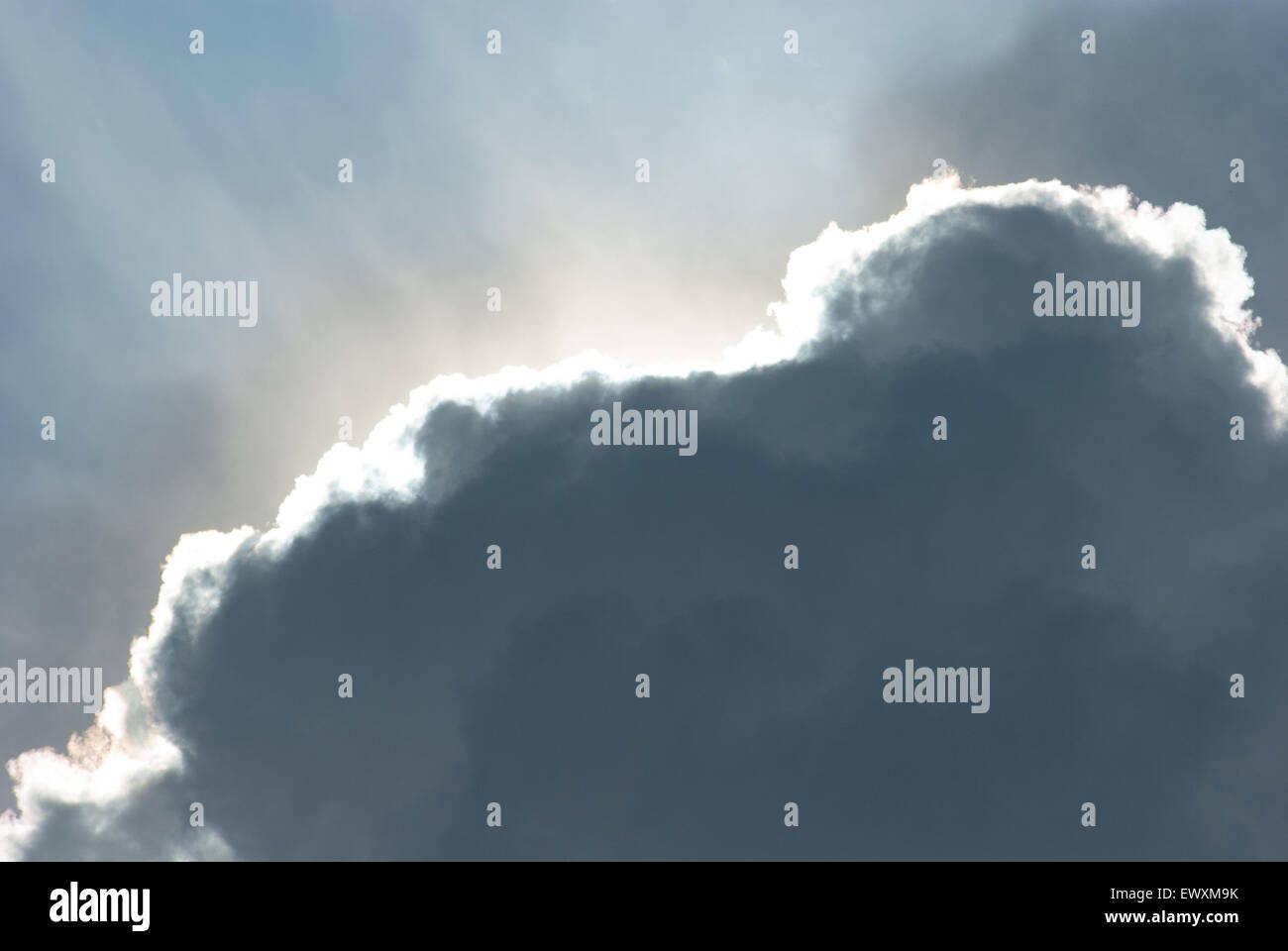 Sun rays from behind a cloud Stock Photo - Alamy