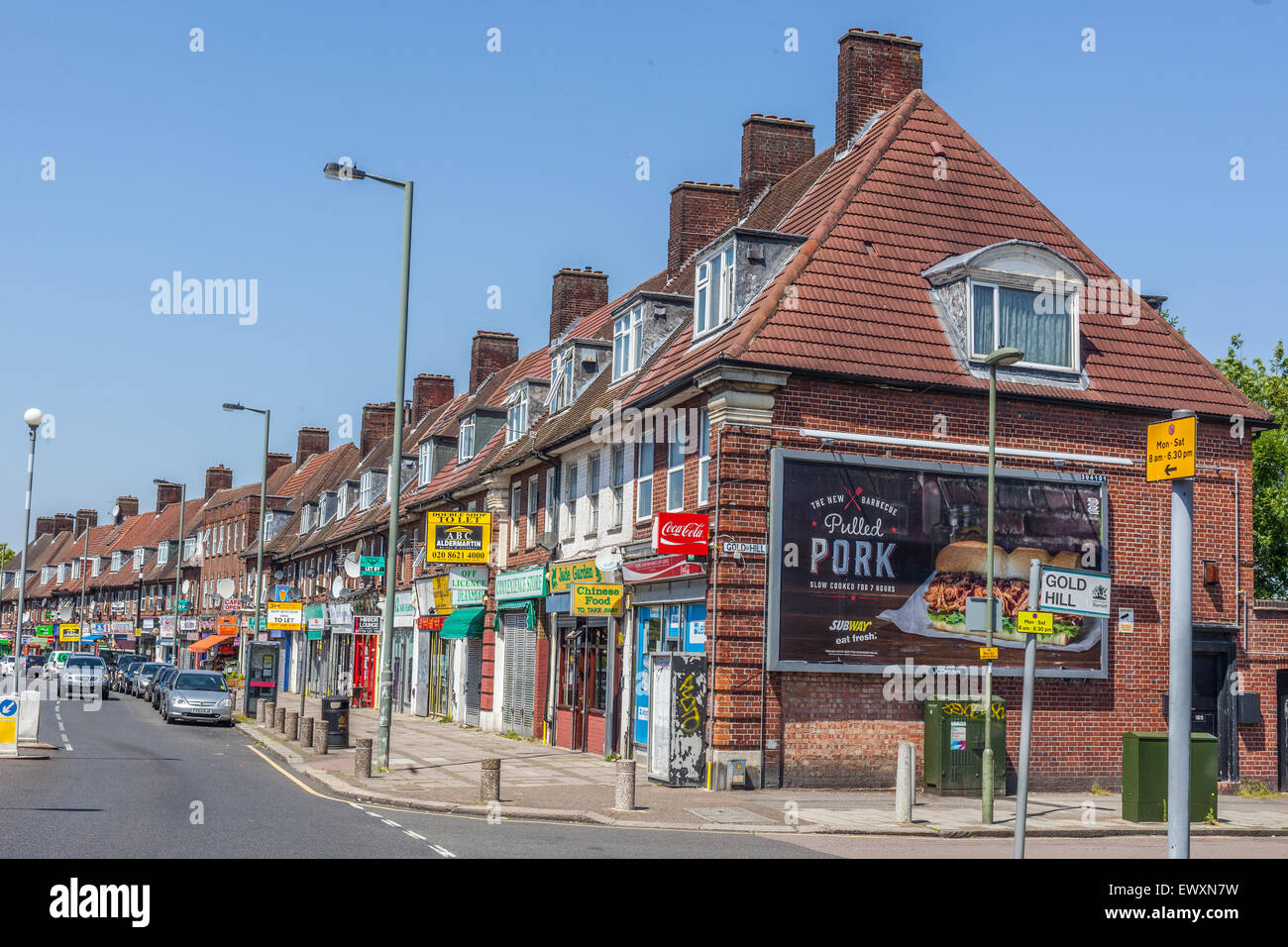 Row of terraced houses and shops on Deansbrook Road, High street, Edgware, HA8, England, UK. Stock Photo