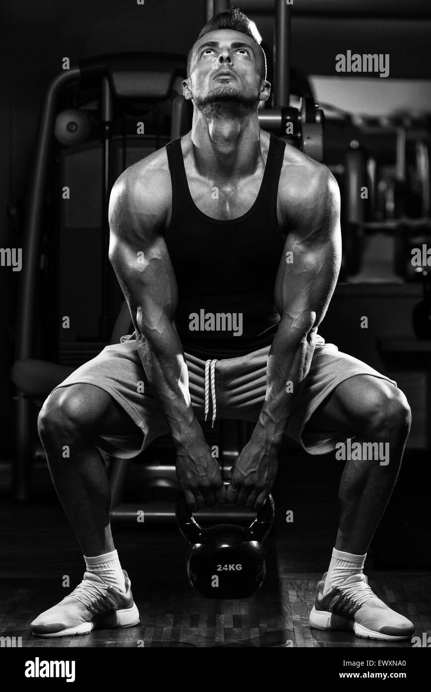 Muscular Man Exercise With Kettle Bell Stock Photo - Alamy