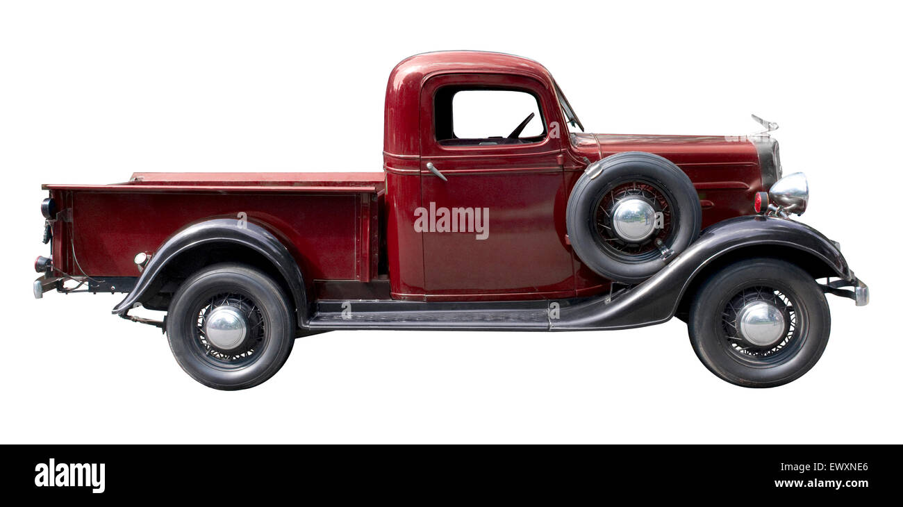 Red vintage pickup truck from 1930s isolated against white background Stock Photo