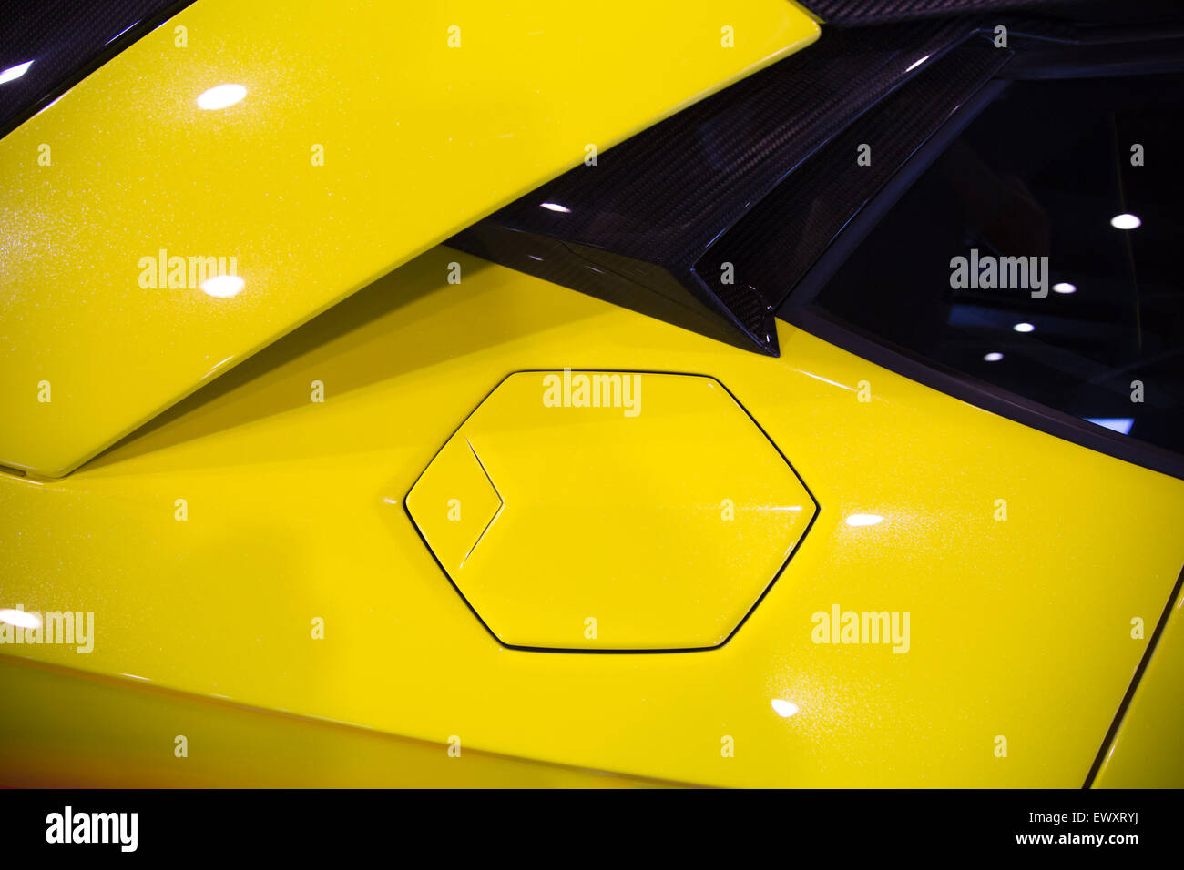 hexagonal fuel cap of a yellow sportscar Stock Photo