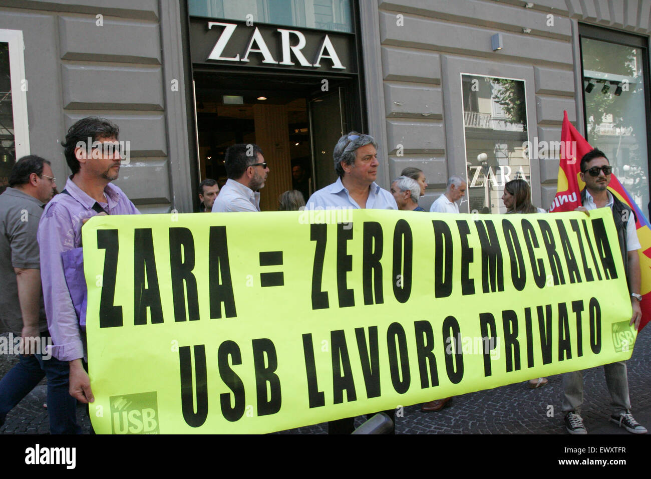 Naples, Italy. 02nd July, 2015. Workers of ZARA, a multinational fashion  firm bring banner during their protest. For months now, the employees of  the firm ask to be represented by the union