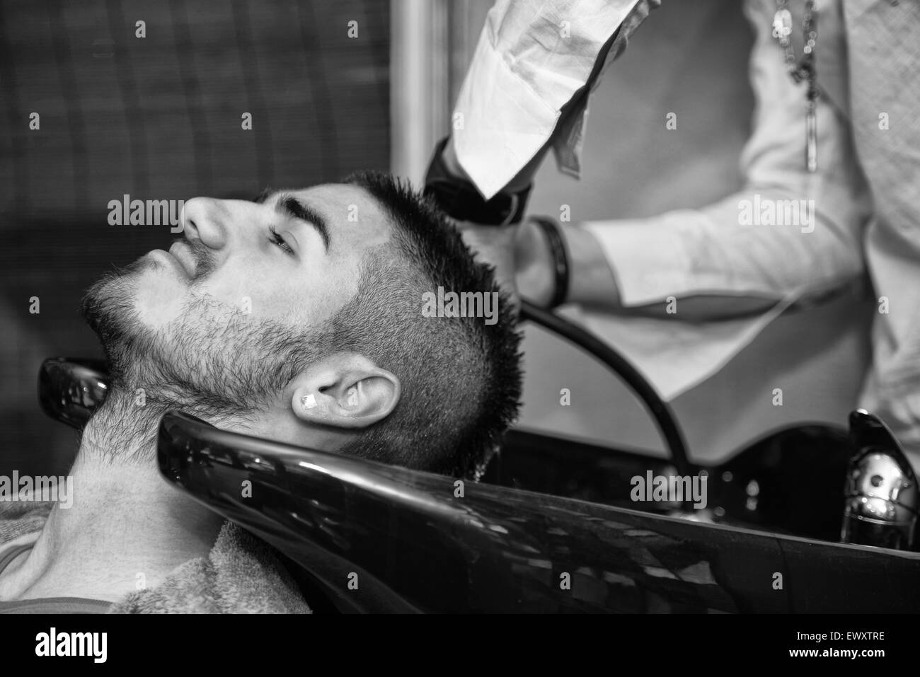 Black man hair wash hi-res stock photography and images - Alamy