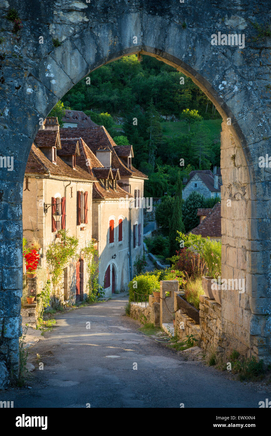 Setting sunlight on homes at entry gate to SaintCirqLapopie, Lot