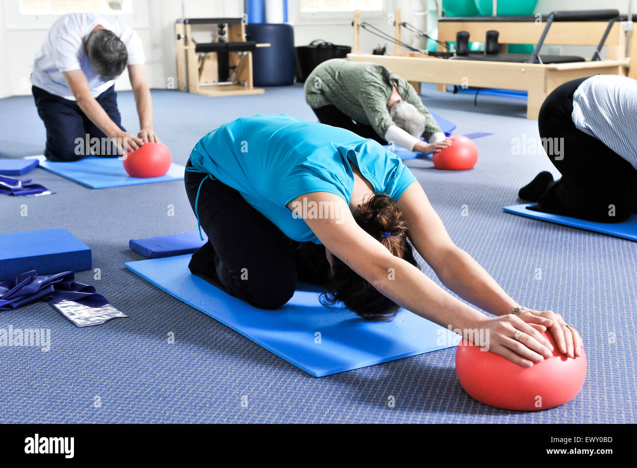 Young woman taking part in a Pilates class. Stock Photo