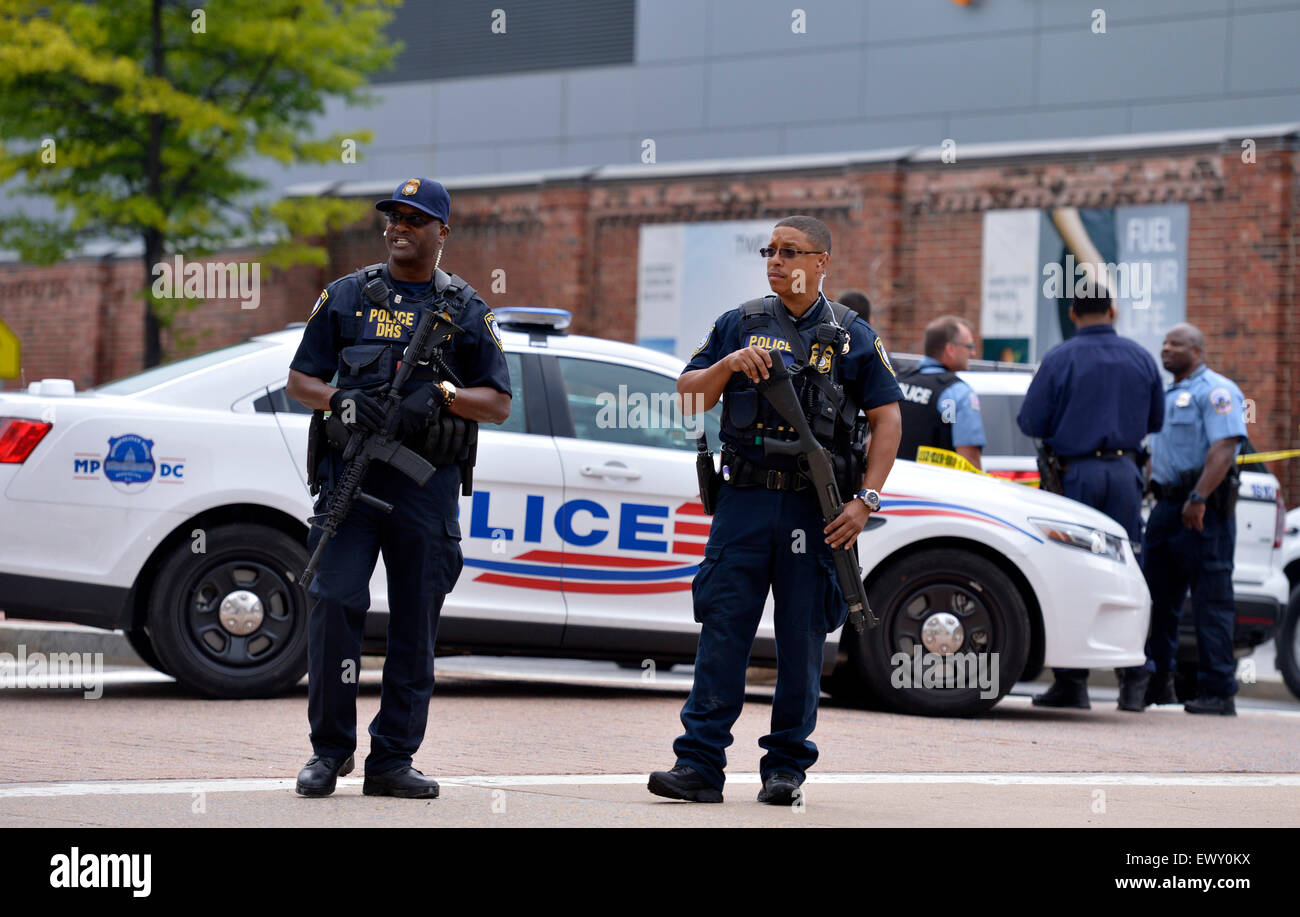 Washington, DC, USA. 2nd July, 2015. Policemen guard near the scene of a shooting at Navy Yard in Washington, DC, the United States, July 2, 2015. Police were responding to a report of an active shooter at the Washington Navy Yard in southeast of the U.S. capital Thursday morning, U.S. media reported. Credit:  Yin Bogu/Xinhua/Alamy Live News Stock Photo