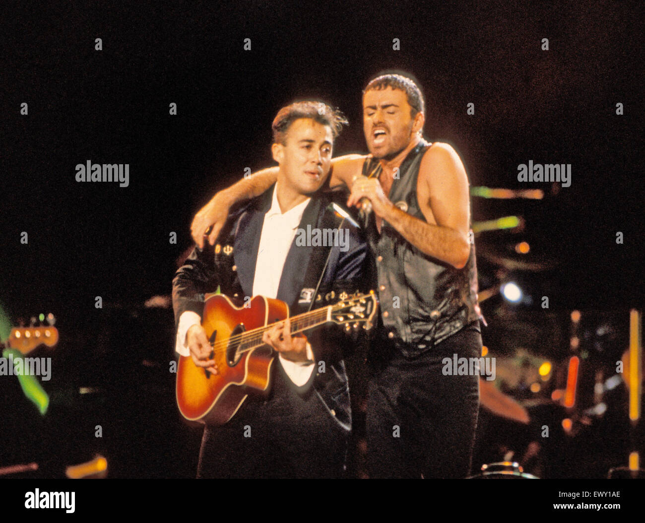 WHAM ! UK pop duo of Andrew Ridgeley on guitar and George Michael about  1984 Stock Photo - Alamy