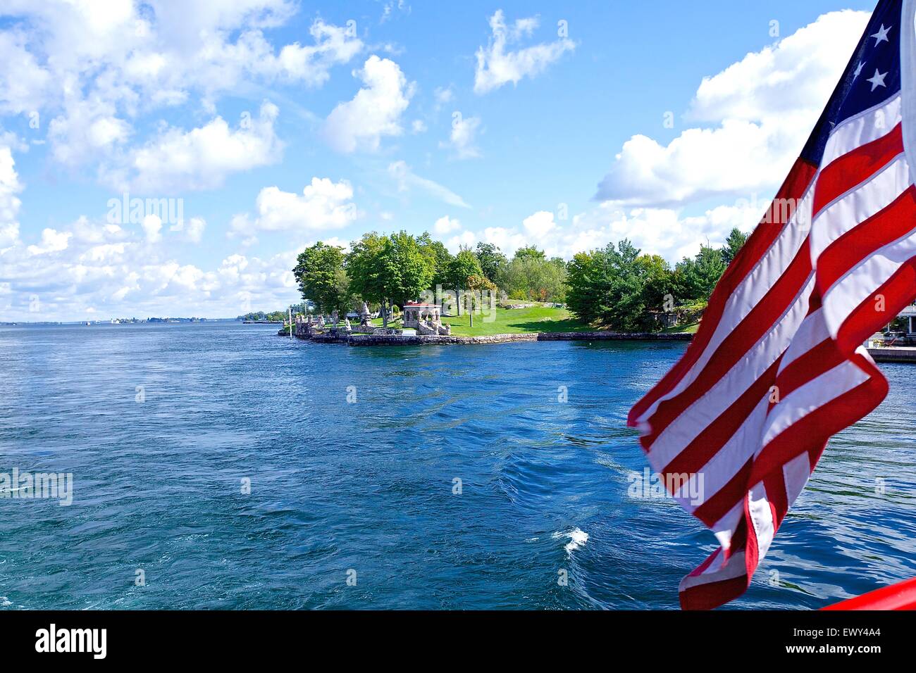 American flag flying against blue sky Stock Photo - Alamy