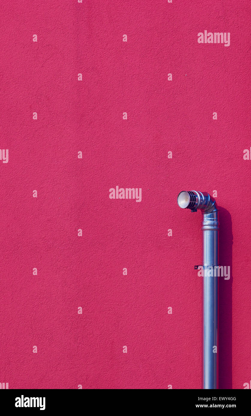 Metal pipe against bright pink wall Burano Venetian Lagoon Veneto Italy Europe Stock Photo
