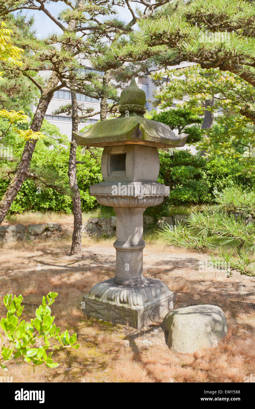 Traditional Japanese stone lantern (toro) in the park of Takamatsu