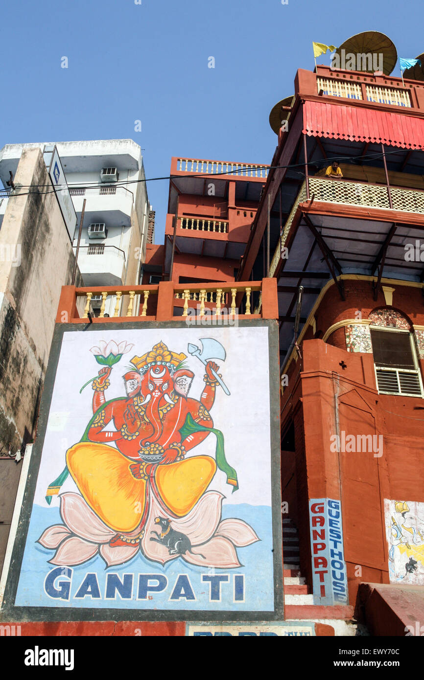 Entrance and wall mural to Ganpati Guest House cheap / budget accommodation with rooftop restaurant overlooking bathing ghats al Stock Photo