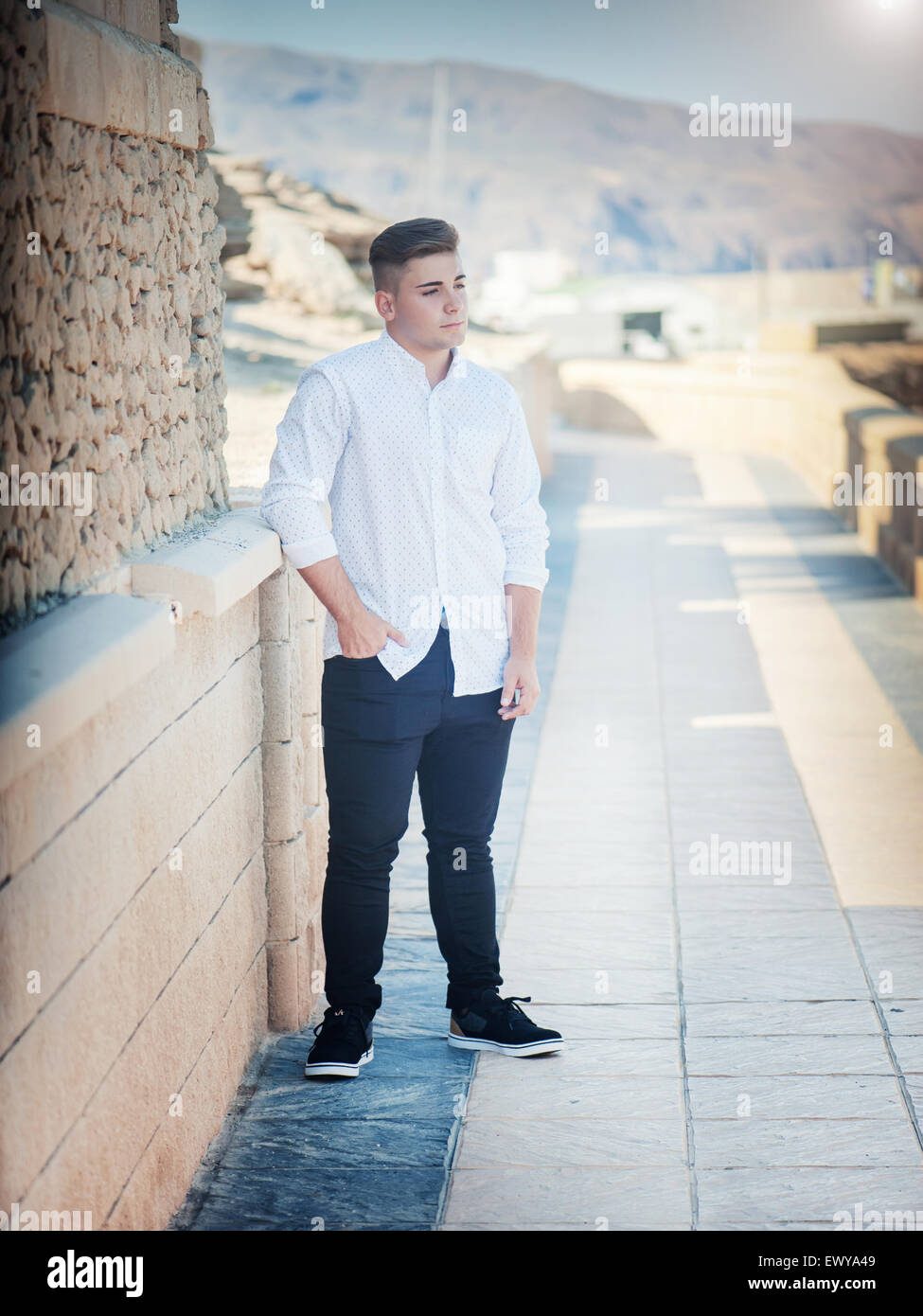 Photo handsome guy in a shirt on a background of nature Stock Photo