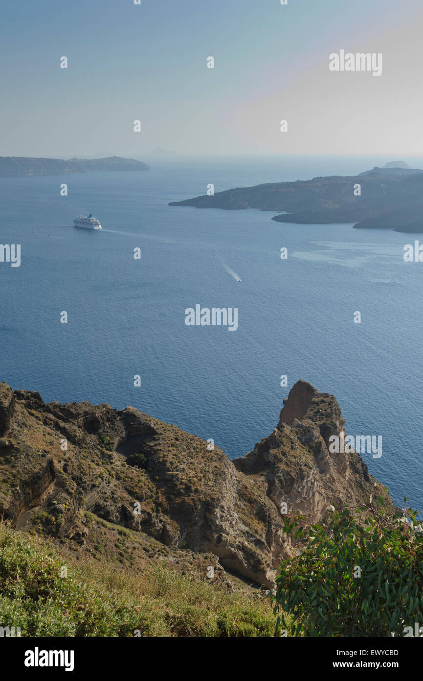 A panoramic view from the Caldera with a cruise ship sailing away, Fira, Santorini, Greece Stock