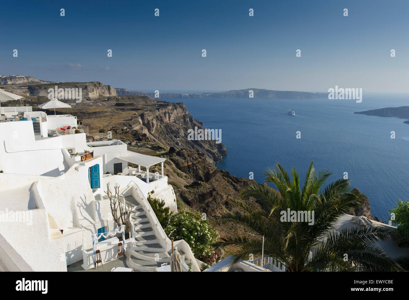 A panoramic view from the Caldera with a cruise ship sailing away, Fira, Santorini, Greece Stock