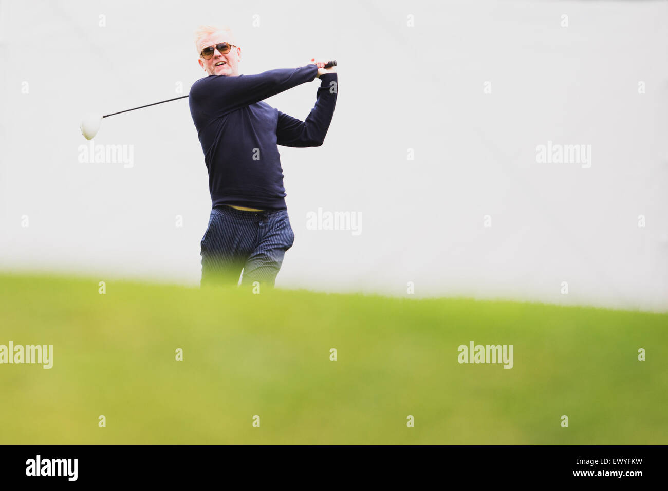 BBC Radio 2 DJ, Chris Evans, tees-off during the Pro-Am ahead of the BMW PGA Championship at Wentworth on May 20, 2015. Stock Photo