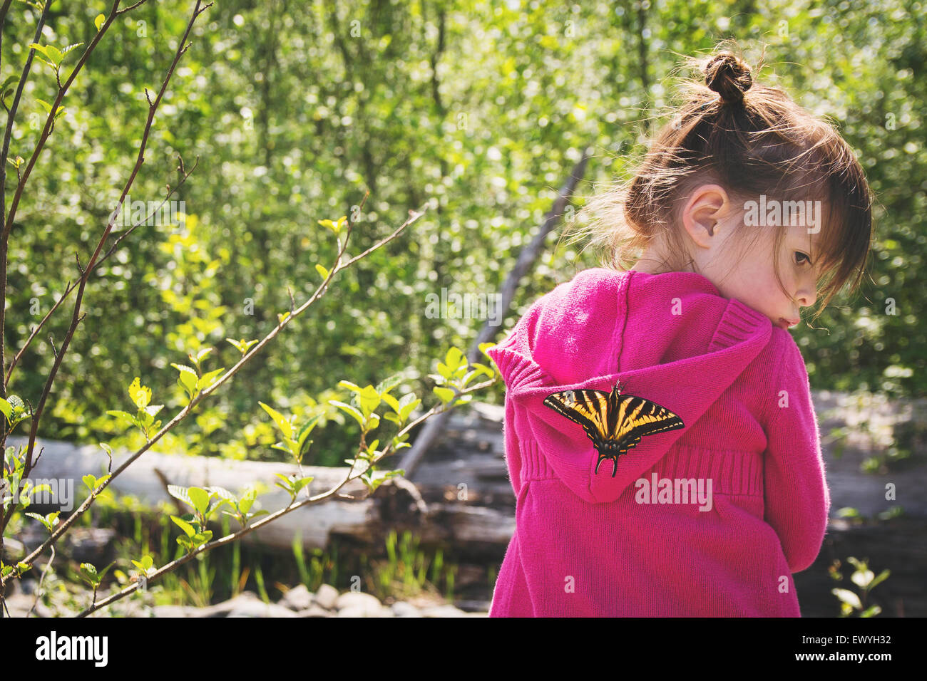 Young girl with a butterfly on her back Stock Photo