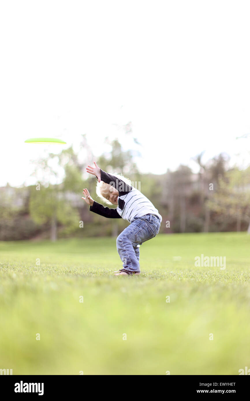 Boy messing about outdoors Stock Photo - Alamy