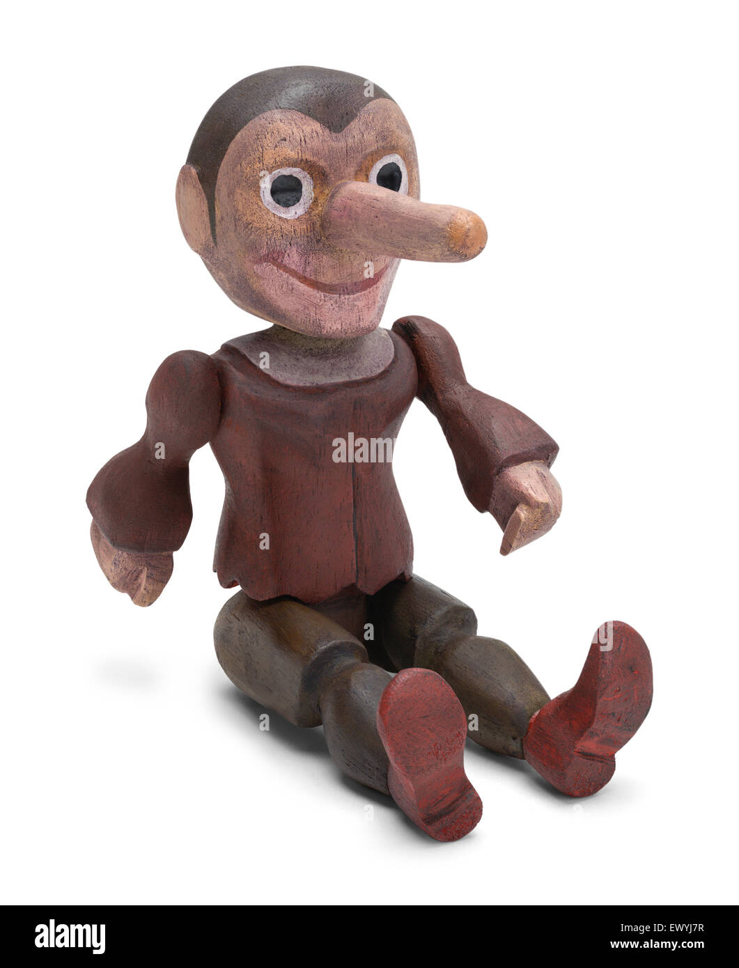 Sitting Pinocchio Wood Doll Isolated on White Background Stock Photo