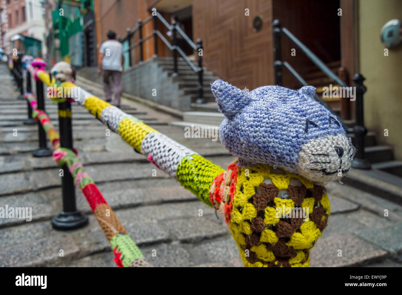 Yarn-bombing works of artist Esther Poon on Pottinger street, in Hong-Kong, Central. Stock Photo