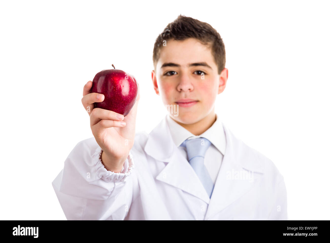 An acne skin child with medical white coat is showing a juicy and tasty red  apple reminding of old saying, An apple a day keeps the doctor away, meaning  the importance of