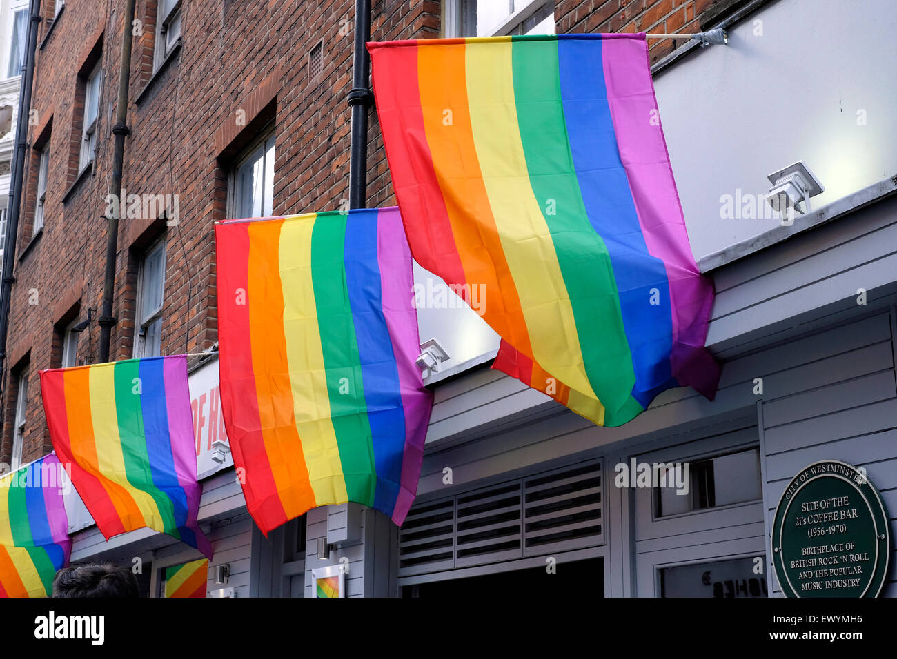 Gay flags flying on top of a pub in Soho, London Stock Photo