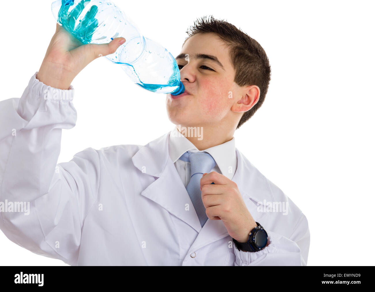A boy doctor in blue tie and white coat with black digital watch drinking water from plastic bottle. His acne skin has not ben retouched Stock Photo