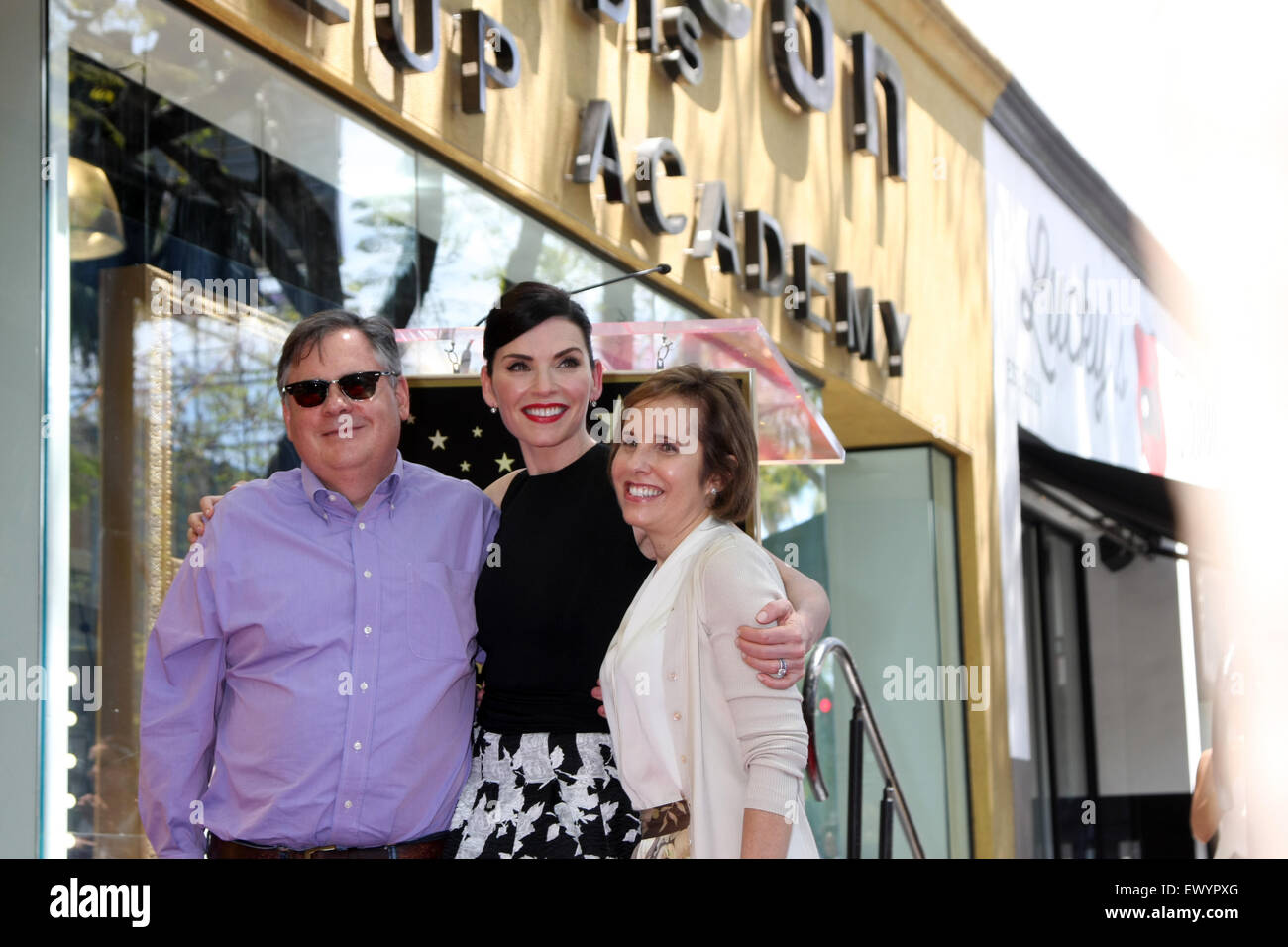 Julianna Margulies honored with a star on the Hollywood Walk of Fame  Featuring: Robert King, Julianna Margulies, Michelle King Where: Los Angeles, California, United States When: 01 May 2015 C Stock Photo