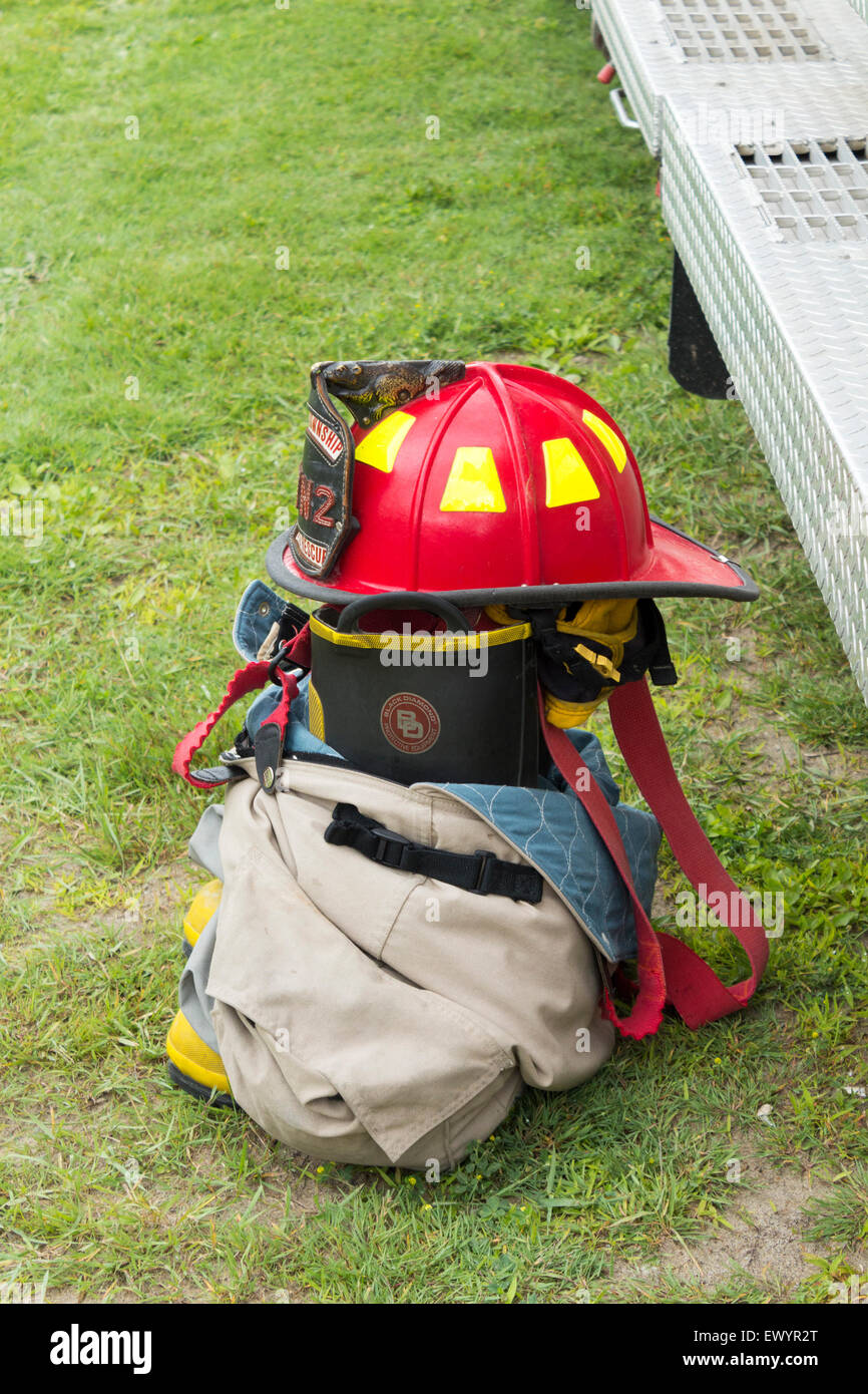 Fire fighter's gear sitting on the ground outside a fire truck Stock Photo